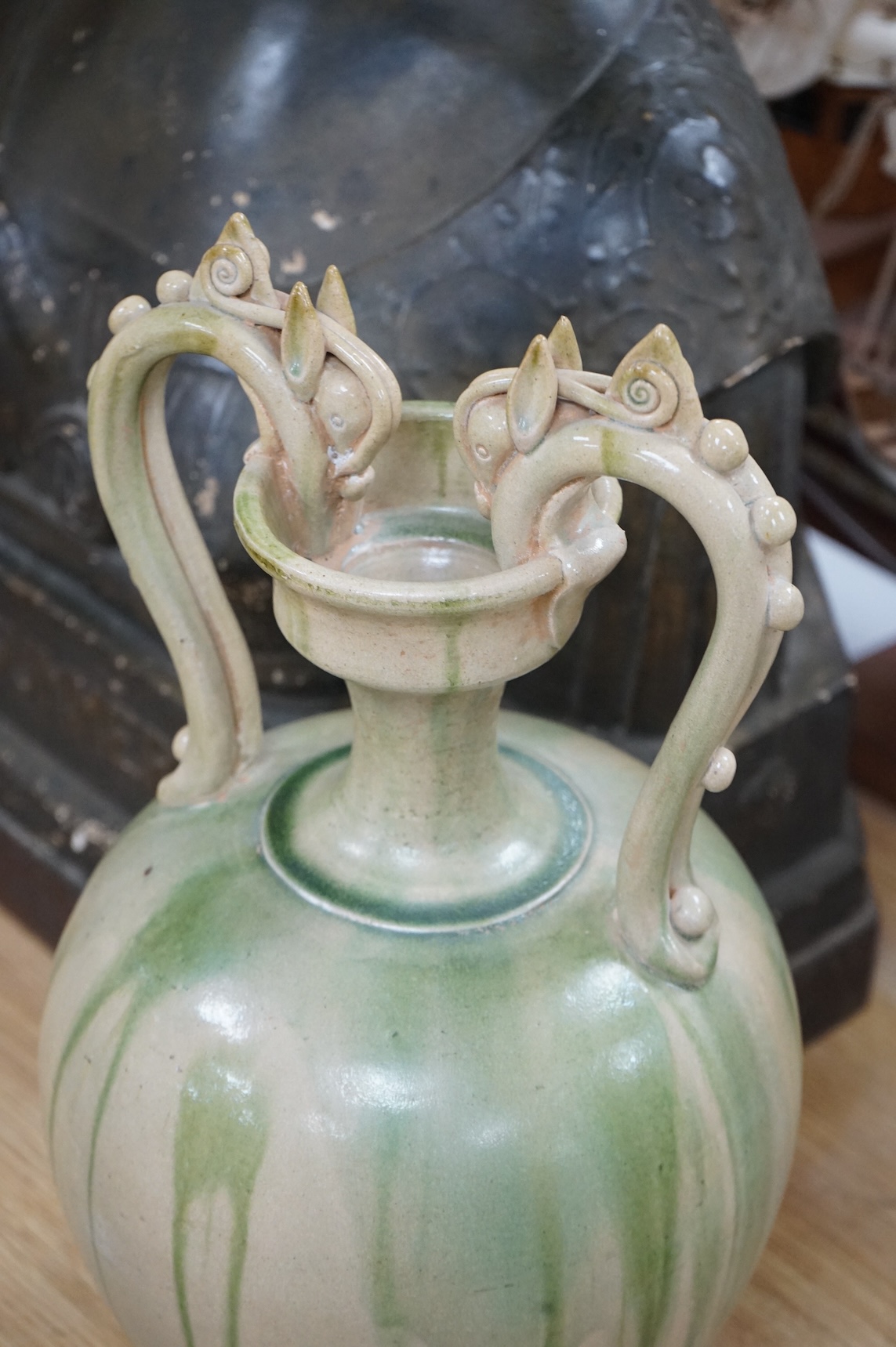 A Chinese green glazed terracotta ‘dragon’ handle vase, 42cm